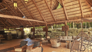 Large, commercial-grade Tiki Hut interior serving as a spacious outdoor lounge area with resort furniture.