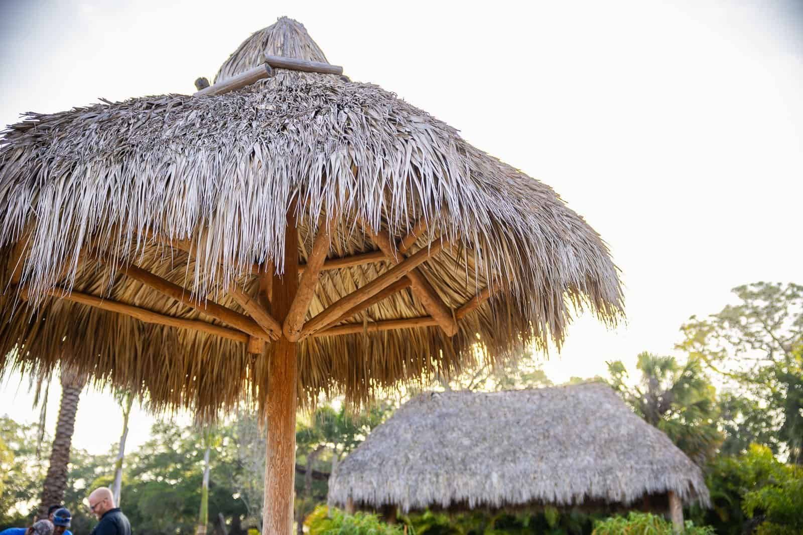 Tiki hut with thatch roof for outdoor tiki bar or lounge in Florida.
